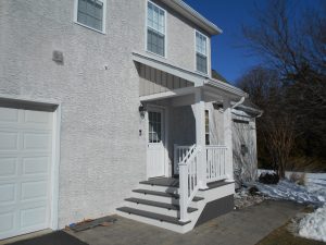 Timbertech PVC Castle Gate deck with porch roof, skirting &#038; step lights