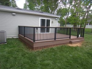 Timbertech PVC English Walnut deck with matching skirting &#038; drink rail, black American series aluminum railings &#8211; Lancaster PA