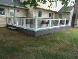 Timbertech PVC Castle Gate deck with Dark Hickory border, matching skirting under deck, white vinyl railings with black aluminum balusters and Castle Gate drink rail top &#8211; New Castle County