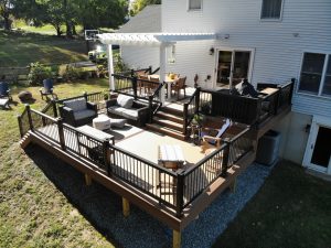 Timbertech PVC Weathered Teak deck with Mahogany border, black vinyl railings with cap lights, white vinyl pergola &#8211; Wilmington DE