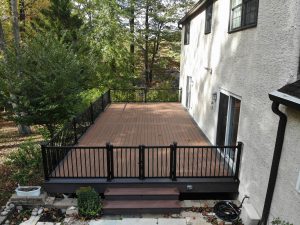 Timbertech PVC Mahogany deck with Dark Hicory border, black American rails with double gate