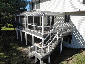 White vinyl pergola over Timbertech PVC Slate Gray deck with Island Oak border &#8211; Lancaster PA